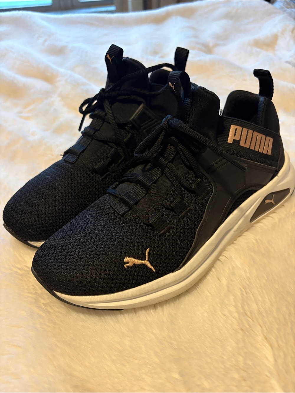 Puma Woman’s Black Sneakers with Gold Accents
